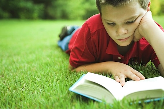 A Young Boy Reading Outside - Photo courtesy of ©iStockphoto.com/NickS, Image #2013115 A Young Boy Reading Outside - Photo courtesy of ©iStockphoto.com/NickS, Image #2013115